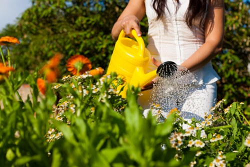 Operative using protective equipment during garden maintenance